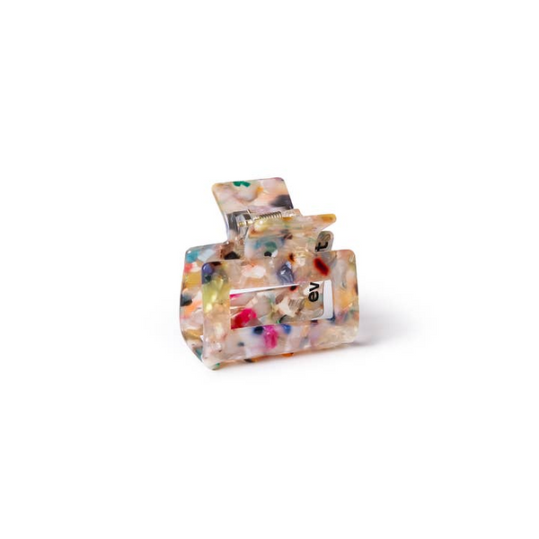 Colorful resin hair clip with 'ev' branding on a white background