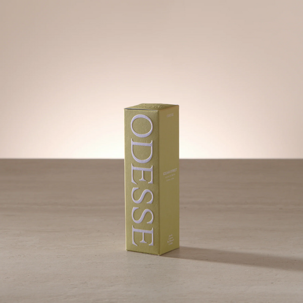Green box with 'ODESSE' branding on a wooden surface