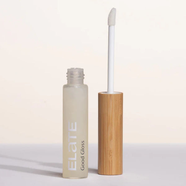 Elate Good Gloss lip gloss with bamboo applicator on a light background