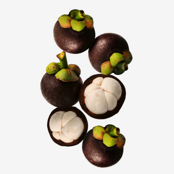 Mangosteen fruits arranged on a white background