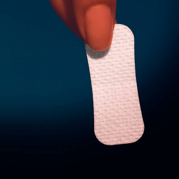 Hand holding Active Humans Deep Sleep Mini Strip Mouth Tape