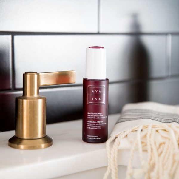 Bottle of The Sunscreen Company Ava Isa Sun-e-Serum Drops SPF 35