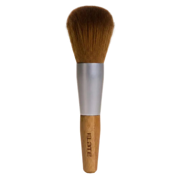 Powder makeup brush with wooden handle and silver ferrule on a beige background