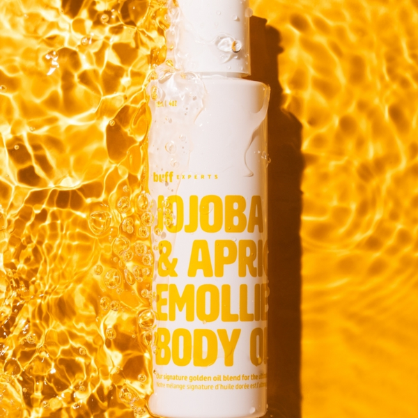 Bottle of Buff Expert Jojoba & Apricot Emollient Body OIl
