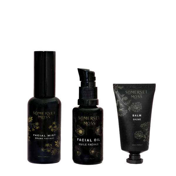 Three black skincare products from Somerset Moss on a white background