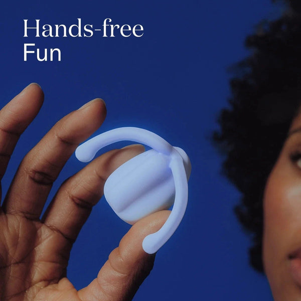 Light blue Eva II Vibrator held by a hand with a blue background and text 'Hands-free Fun'.