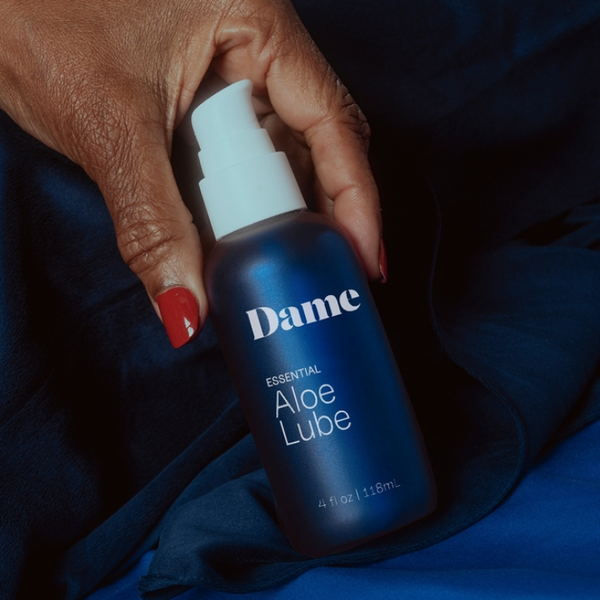 Person holding Dame Aloe Lube