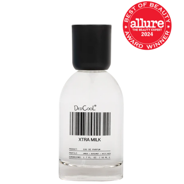 Perfume bottle labeled 'Xtra Milk' with a black cap on a white background, featuring the Allure Best of Beauty Award 2024 logo.