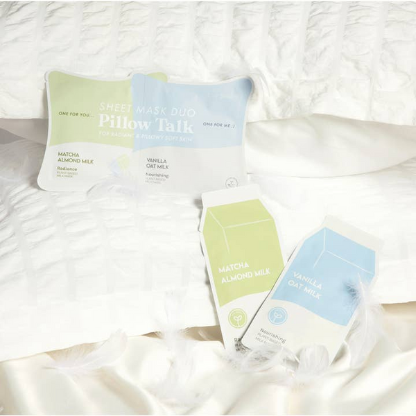 Two packages of 'Pillow Talk' on a white textured surface