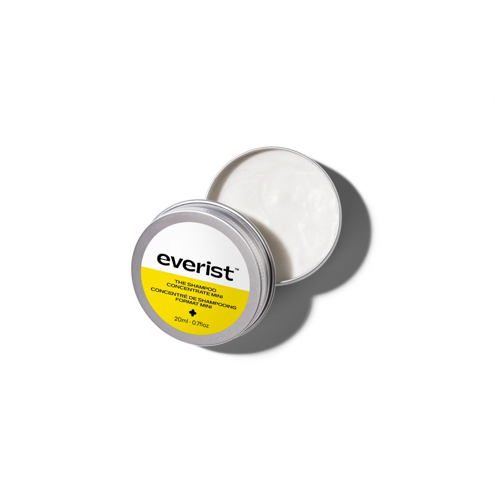 Everist product container with white shampoo concentrate on a white background