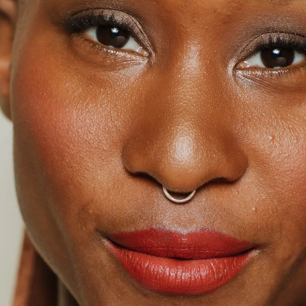 Person wearing Elate Indulge lip stick pencil colour