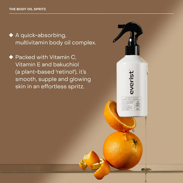 Everist body oil spritz with oranges on a brown background