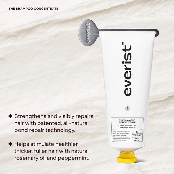 Everist shampoo concentrate bottle with product details on a textured beige background