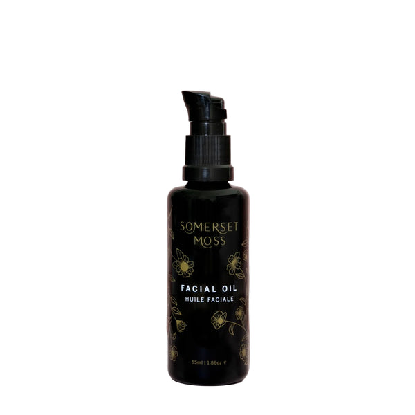 Black facial oil bottle with 'Somerset Moss' branding on a white background