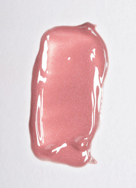 Pink lip gloss in shade Aurora on a white background