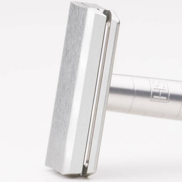Metallic object with a textured surface on a white background