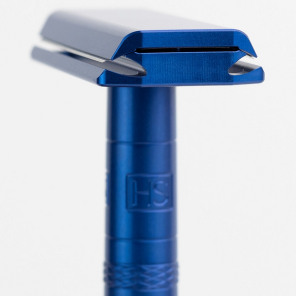 Blue safety razor on a white background