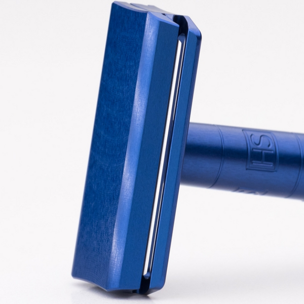 Blue safety razor on a white background