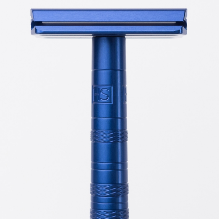 Blue safety razor on a white background