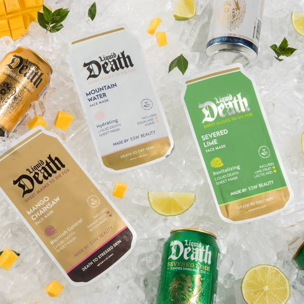 Collection of Liquid Death skincare products on a textured surface with lemon slices.