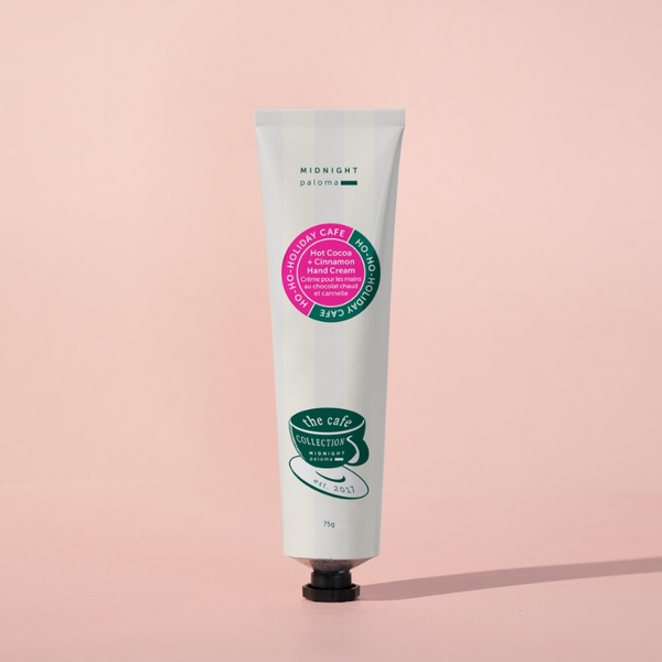 Midnight Paloma Hot Cocoa + Cinnamon Hand Cream pink background
