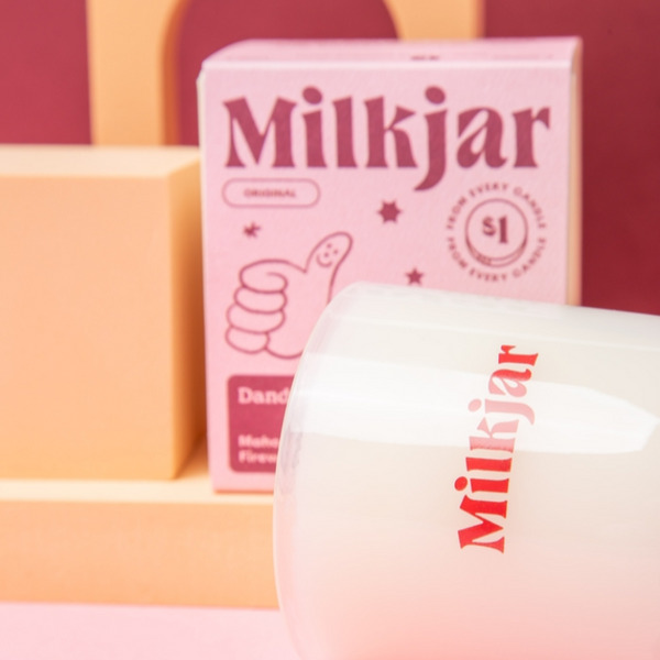 Milkjar product with packaging on a colorful background