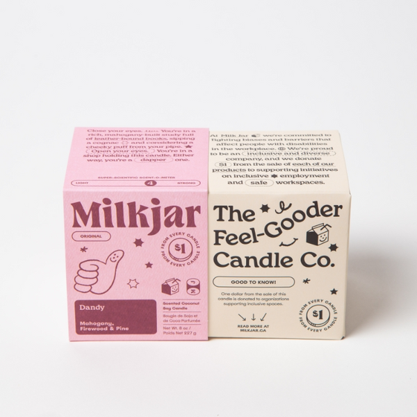 Two candle boxes from Milkjar and The Feel-Gooder Candle Co. on a white background