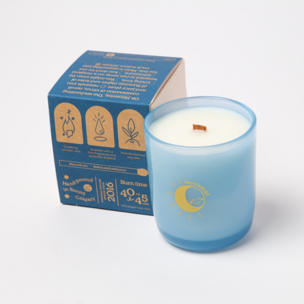 Blue candle with packaging on a white background