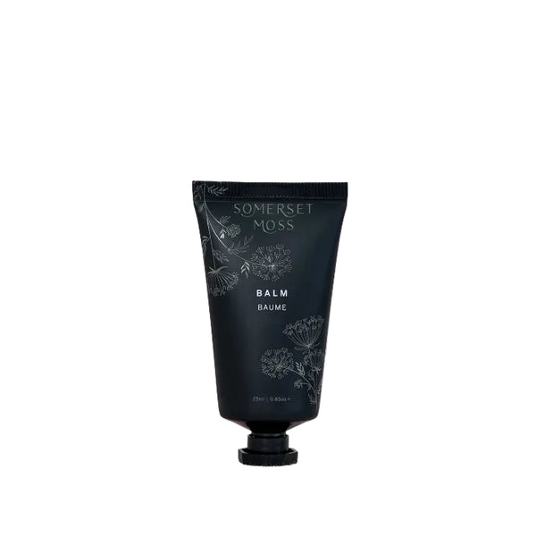 Black balm tube with 'Somerset Moss' branding on a beige background