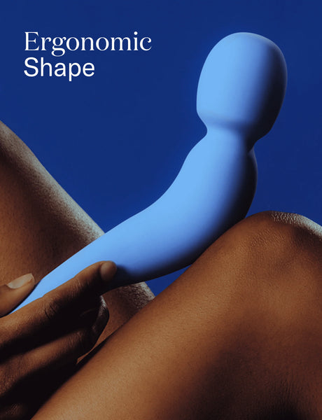 Blue Com wand Vibe by Same held by a person against a blue background with 'Ergonomic Shape' text.