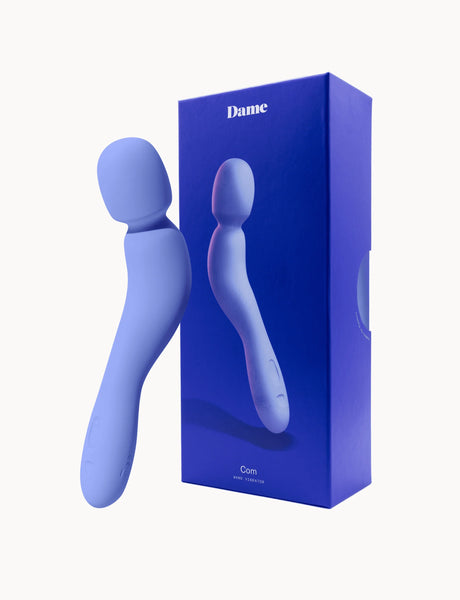 Blue Com External Wand Vibrator by Dame with packaging on a white background