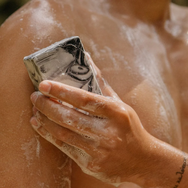 person using Rocky Cold Pressed Fennel & Charcoal bar soap