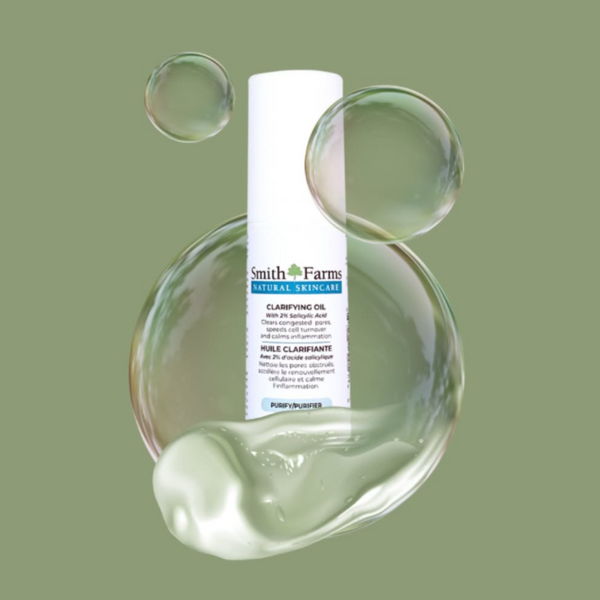 Smith Farms clarifying oil bottle with oil on a green background