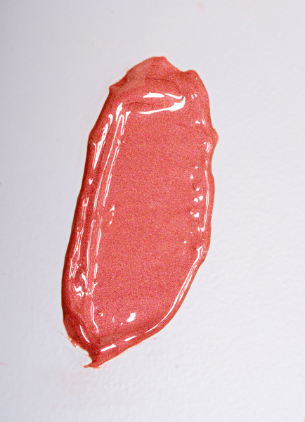 Pink lip gloss swatch in shade Solara from Elate's Good Gloss line on a white background