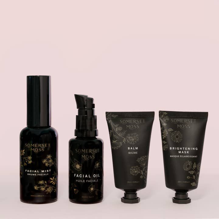 Set of Somerset Moss skincare products on a light pink background