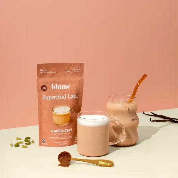 sachet of Blume Superfood Latte Vanilla Chai in a glass