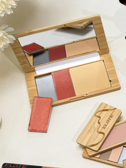 The capsule  palette filled with two blush balms and a press foundation powder. 