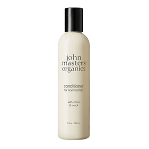 John Masters Organics conditioner bottle on a white background