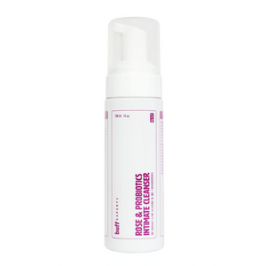 White bottle of Rose & Probiotics Intimate Cleanser by Buff Experts with pink text on a white background
